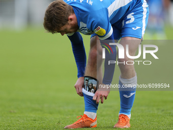 Barrow's Luke James shows off his personalised shin pads during the Sky Bet League 2 match between Harrogate Town and Barrow at Wetherby Roa...