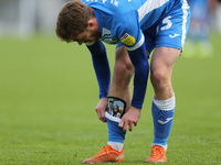 Barrow's Luke James shows off his personalised shin pads during the Sky Bet League 2 match between Harrogate Town and Barrow at Wetherby Roa...
