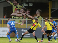 during the Sky Bet League 2 match between Harrogate Tom Beadling in action with Harrogate Town's  Jonathan Stead Town and Barrow at Wetherby...