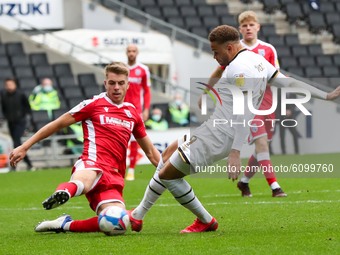 Carlton Morris scores for Milton Keynes Dons, to extend their lead making it 2 - 0 against Gillingham, during the Sky Bet League One match b...