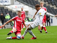 Carlton Morris scores for Milton Keynes Dons, to extend their lead making it 2 - 0 against Gillingham, during the Sky Bet League One match b...