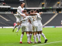 Carlton Morris celebrates after scoring for Milton Keynes Dons, to extend their lead making it 2 - 0 against Gillingham, during the Sky Bet...