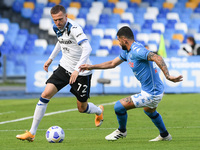 Josip Ilicic of Atalanta BC and Elseid Hysaj of SSC Napoli compete for the ball during the Serie A match between SSC Napoli and Atalanta BC...