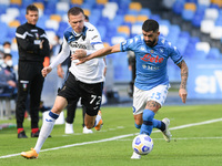 Josip Ilicic of Atalanta BC and Elseid Hysaj of SSC Napoli compete for the ball during the Serie A match between SSC Napoli and Atalanta BC...
