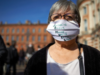A teache wears a face mask reading 'Solidarity Love World Unity Freedom Expression' which in French gives 'S.A.M.U.E.L'. After the killing o...