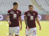Sasa Lukic of Torino FC and Karol Linetty of Torino FC during the Serie A football match between Torino FC and Cagliari Calcio at Olympic Gr...