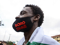 A protester is seen with a nose mask writing on it “SORO SOKE” English meaning “SPEAK UP”, in Lagos on October 19, 2020. As Christians hold...