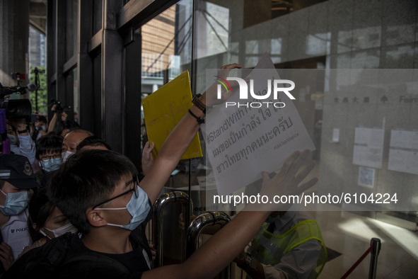 Pro-Democracy activist Joshua Wong is seen placing Placards on the door of the building where the Royal Thai Consulate General of Hong Kong...