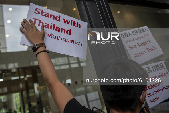 Pro-Democracy activist Joshua Wong is seen placing Placards on the door of the building where the Royal Thai Consulate General of Hong Kong...