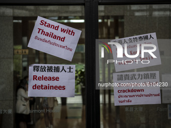 Placards are seen placed on the window of the building where the Royal Thai Consulate General of Hong Kong is located  on October 19, 2020 i...