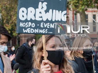 Hundreds of hospitality workers take part in a demonstration in Parliament Square against the lack of scientific evidence behind the new cor...
