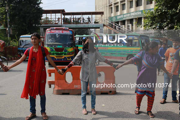 Students and activists block roads as they protest against recent alleged rape and torture of a woman in the southern district of Noakhali,...