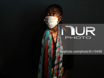 A Palestinian girl wearing a face mask amid the Covid-19 pandemic at her home in Gaza city, on October 20, 2020.  (