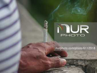 Smoker in public is seen in Antipolo City, October 22, 2020. Cigarettes in Philippines are not hard to avail because it can be sold in the s...