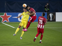 Villarreal's Carlos Bacca  (L) junps with Defender  of Sivasspor Caner Osmanpaşa   during  Europa League  match betwee Villarreal CF and Siv...