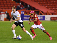 
Lyle Taylor of Nottingham Forest closes on Matthew Clarke of Derby County during the Sky Bet Championship match between Nottingham Forest a...