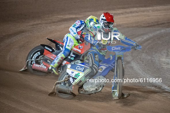 
Richie Worrall (Red) picks up some drive ahead of Chris Harris (Yellow) during the Peter Craven Memorial Trophy at the National Speedway St...