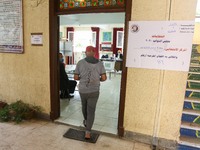 A man going casts his vote in polling station at Dokki district during the first round of the first phase of the Egyptian parliamentary elec...