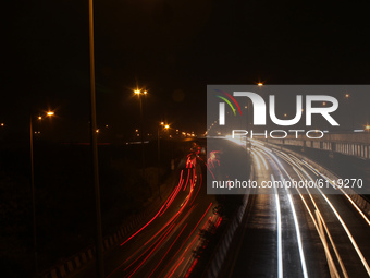 Light trails are left by passing traffic over a flyover in New Delhi, India, on October 24, 2020. Delhi's air quality remained in the 
