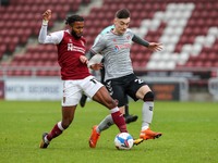 Northampton Town's Ricky Korboa is challenged by Charlton Athletic's Dylan Levitt during the first half of the Sky Bet League One match betw...