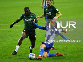 Plymouths Frank Nouble battle with Wigans Tom James during the Sky Bet League 1 match between Wigan Athletic and Plymouth Argyle at the DW S...