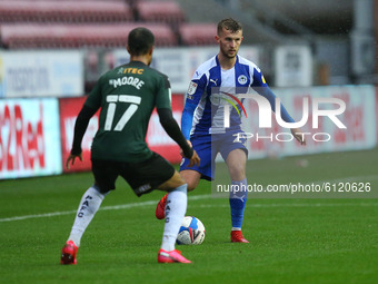 Wigans Tom James tries a run on Plymouths Byron Moore during the Sky Bet League 1 match between Wigan Athletic and Plymouth Argyle at the DW...