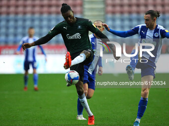Plymouths Jerome Opoku battles with Wigans Will Keane during the Sky Bet League 1 match between Wigan Athletic and Plymouth Argyle at the DW...