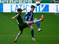 Plymouths Joe Edwards battles with Wigans Tom Pearce during the Sky Bet League 1 match between Wigan Athletic and Plymouth Argyle at the DW...