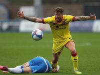 Walsall's Dan Scarr and Barrow's Josh Kay during the Sky Bet League 2 match between Barrow and Walsall at the Holker Street, Barrow-in-Furne...