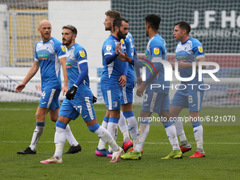 Dior Angus of Barrow celebrates with his team mates after scoring their first goal scores from the penalty spot during the Sky Bet League 2...