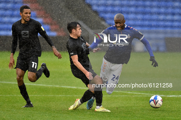 Oldham Athletic's Dylan Bahamboula and Port Vale's David Worrall in action during the Sky Bet League 2 match between Oldham Athletic and Por...