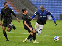 Oldham Athletic's Dylan Bahamboula and Port Vale's David Worrall in action during the Sky Bet League 2 match between Oldham Athletic and Por...