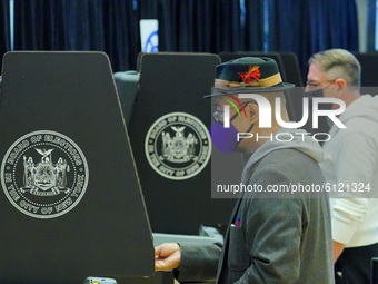 People cast their votes at Madison Square Garden during early voting for the U.S. Presidential election on October 24, 2020 in New York City...