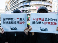 Protesters holding a signs with the words: Fulfil the promise of providing humanitarian aid! Save Hong Kong People that arrive at Taiwan on...