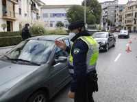 Police control in Granada (Spain) to restrict the movement of citizens due to the large increase in coronavirus cases. 
The population of Gr...