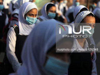 Palestinian students participate in a morning activity as schools partially reopened amid the coronavirus disease (COVID-19) outbreak,  in G...