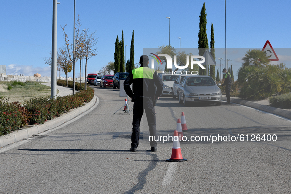 Local police control people's movement in a traffic checkpoint, under partial lockdown, in the town of Majadahonda, Madrid on 26th October,...