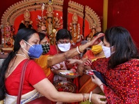 Hindu married women during 'Sindur Khela' (applying vermilion) on the occasion of ‘Bijoya Dashami’ at a Durga Puja pandal 'Durgabari' in Jai...