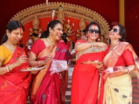 Hindu married women during 'Sindur Khela' (applying vermilion) on the occasion of ‘Bijoya Dashami’ at a Durga Puja pandal 'Durgabari' in Jai...