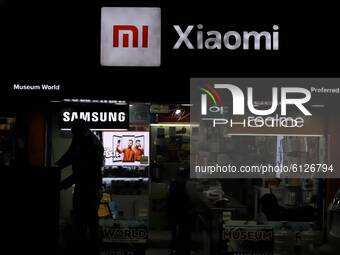 Xiaomi MI, Realme and Samsung Logos are seen on a billioard of a Electronics shop in Sopore, District Baramulla, Jammu and Kashmir, India on...