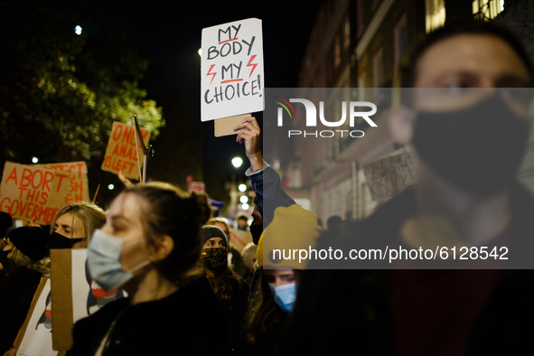 Opponents of Poland's new abortion restrictions demonstrate outside the Polish Embassy on Portland Place in London, England, on October 26,...