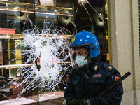 Damage and looting of downtown shops occurred after protesters clashed with riot police during a protest against the government-imposed bloc...