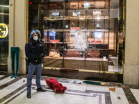 Damage and looting of downtown shops occurred after protesters clashed with riot police during a protest against the government-imposed bloc...