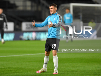 
Jason Knight of Derby County warms up ahead of kick-off during the Sky Bet Championship match between Derby County and Cardiff City at the...