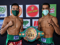 Wanchana Meenayothin of Thailand former WBC Inter Continental Youth Champion (left) face off Omar Elquers of Morocco (right) during the weig...