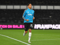 
Curtis Davies of Derby County warms up ahead of kick-off during the Sky Bet Championship match between Derby County and Cardiff City at the...