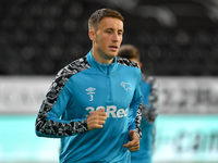 
Craig Forsyth of Derby County warms up ahead of kick-off during the Sky Bet Championship match between Derby County and Cardiff City at the...