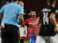 Maxime Gonalons, of Granada CF and Antonio Colak, of PAOK FC during the UEFA Europa League Group E stage match between Granada CF and PAOK F...