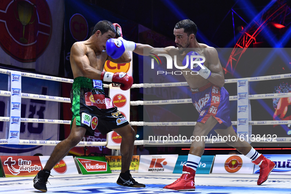 Omar Elquers of Morocco (blue) punches Wanchana Meenayothin of Thailand during the WBC Asia Super Featherweight (130 LBS.) title bout at Ran...