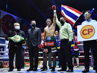 Wanchana Meenayothin of Thailand celebrates after winning his bout against Omar Elquers of Morocco during the WBC Asia Super Featherweight (...